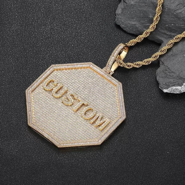 Take personalization to the next level with this bold Custom 3D Octagonal Letter Pendant in Yellow Gold. Measuring 80mm, this pendant offers a large, eye-catching design that allows you to display your initials or favorite letters. The Yellow Gold-plated finish ensures durability and a luxurious shine, making it perfect for daily wear or special occasions. Hypoallergenic, waterproof, and scratch-resistant, it’s designed to last. The octagonal shape gives it a modern twist, making it a standout accessory for anyone looking to add a touch of Hip-Hop style to their look.