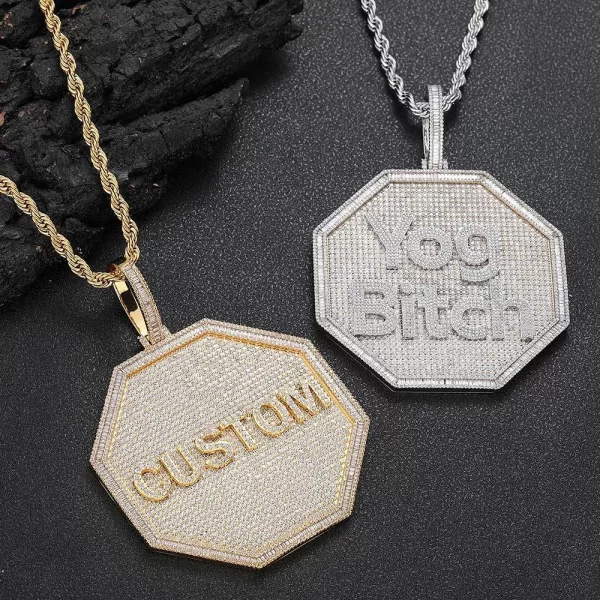 Take personalization to the next level with this bold Custom 3D Octagonal Letter Pendant in Yellow Gold. Measuring 80mm, this pendant offers a large, eye-catching design that allows you to display your initials or favorite letters. The Yellow Gold-plated finish ensures durability and a luxurious shine, making it perfect for daily wear or special occasions. Hypoallergenic, waterproof, and scratch-resistant, it’s designed to last. The octagonal shape gives it a modern twist, making it a standout accessory for anyone looking to add a touch of Hip-Hop style to their look.