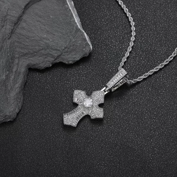 For a sleek and contemporary take, the White Gold Iced Baguette Cross Pendant offers the same faith-inspired design in a cool, modern finish. The 21mm pendant features VVS simulated diamonds in baguette cuts, framed in White Gold-plated metal. Hypoallergenic, scratch-resistant, and waterproof, it’s designed for both everyday wear and special events. The White Gold finish adds a cool elegance to this timeless yet modern Hip Hop accessory.