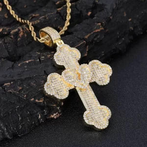 The Iced Heartbroken Cross Pendant in Yellow Gold combines love, faith, and a Hip-Hop edge. Featuring a broken-heart cross design adorned with VVS simulated diamonds, this pendant shines with both spiritual and stylish appeal. The Yellow Gold plating adds a warm glow to the bold design, making it perfect for anyone who wants to express their faith in a unique way. Waterproof, hypoallergenic, and scratch-resistant, it's designed for everyday wear and stands out as a meaningful gift or personal statement piece. Whether worn solo or layered, this pendant blends emotion with Hip-Hop culture seamlessly.