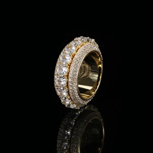 The 5 Layer Iced Spinner Ring combines luxury and playfulness. With five layers of VVS Simulated Diamonds and a spinning feature, this Yellow Gold ring is not only eye-catching but also interactive. Perfect for those who love to accessorize with unique, Hip Hop-inspired pieces, this ring brings a dynamic flair to any outfit.