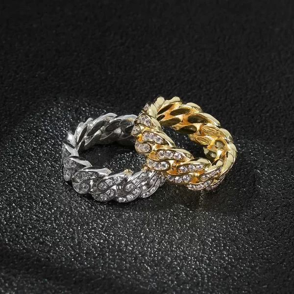 The Iced Prong Cuban Link Ring in White Gold - 8mm is the ultimate statement piece for Hip Hop enthusiasts. Featuring prong-set VVS Simulated Diamonds and a White Gold finish, this ring offers maximum shine and durability. The 8mm width adds a bold touch, making it ideal for those who want to stand out while staying stylish and sophisticated.