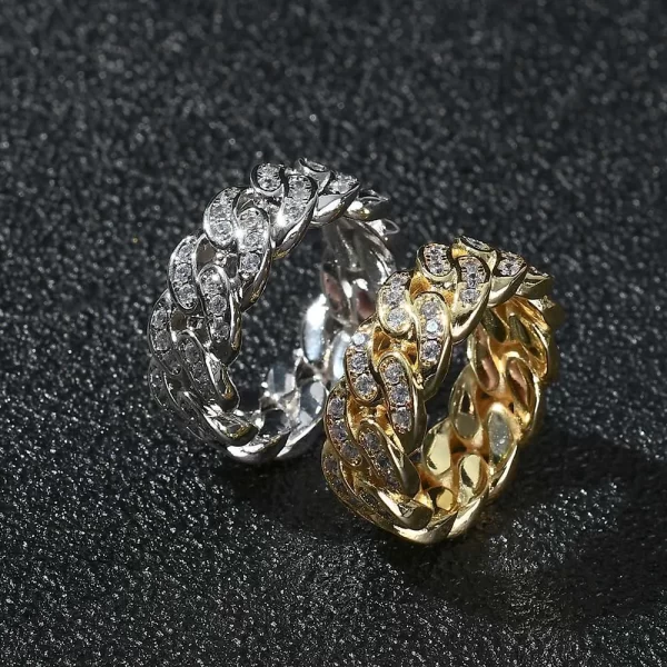 The Iced Prong Cuban Link Ring in Yellow Gold - 8mm brings the iconic Cuban link style to your fingers. With prong-set VVS Simulated Diamonds and a luxurious Yellow Gold finish, this ring combines both elegance and boldness. Its 8mm width offers a standout look, perfect for Hip Hop fans who want to add a touch of style to both casual and formal outfits. The durable design ensures it lasts through all occasions, adding shine to any wardrobe.