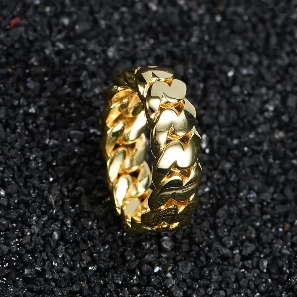 The No-Stone Cuban Ring in Yellow Gold offers a minimalist approach to classic Cuban link style. With no stones, this Yellow Gold ring delivers a clean, bold look perfect for those who prefer understated elegance. Ideal for Hip Hop fans seeking subtle luxury, the smooth design makes this ring versatile enough for both casual and formal wear, while still offering a touch of flair.