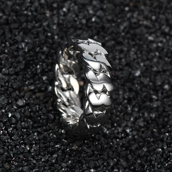 The No-Stone Cuban Ring in White Gold is a refined take on the classic Cuban link style. With no stones, this White Gold ring offers a sleek and understated look, perfect for those who appreciate subtle sophistication. Ideal for Hip Hop enthusiasts, the minimalist design allows for versatility in both everyday wear and formal occasions.