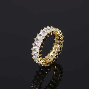 The 1 Layer Iced Prong Ring in Yellow Gold offers a sleek, elegant design with a single layer of VVS Simulated Diamonds set in a luxurious Yellow Gold band. Its prong setting ensures maximum shine, making it the perfect ring for adding both luxury and boldness to your everyday look. Whether you're dressing up for a formal event or going for a more casual Hip Hop vibe, this ring delivers the right amount of impact.