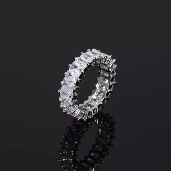 The 1 Layer Iced Prong Ring in White Gold offers a minimalist yet luxurious design with a single layer of VVS Simulated Diamonds. This White Gold ring shines brilliantly with its prong setting, making it ideal for those who appreciate understated elegance in their Hip Hop jewelry collection. Its versatile style makes it perfect for both casual and formal wear.