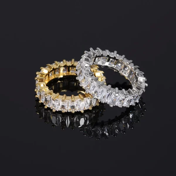 The 1 Layer Iced Prong Ring in Yellow Gold offers a sleek, elegant design with a single layer of VVS Simulated Diamonds set in a luxurious Yellow Gold band. Its prong setting ensures maximum shine, making it the perfect ring for adding both luxury and boldness to your everyday look. Whether you're dressing up for a formal event or going for a more casual Hip Hop vibe, this ring delivers the right amount of impact.