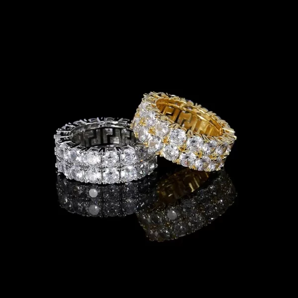 Take your look to the next level with the 2 Layer Iced Prong Ring in Yellow Gold. Featuring two layers of VVS Simulated Diamonds set in a bold Yellow Gold band, this ring delivers extra shine and luxury. Its stacked design makes it the perfect accessory for those who want to stand out with their Hip Hop-inspired jewelry.