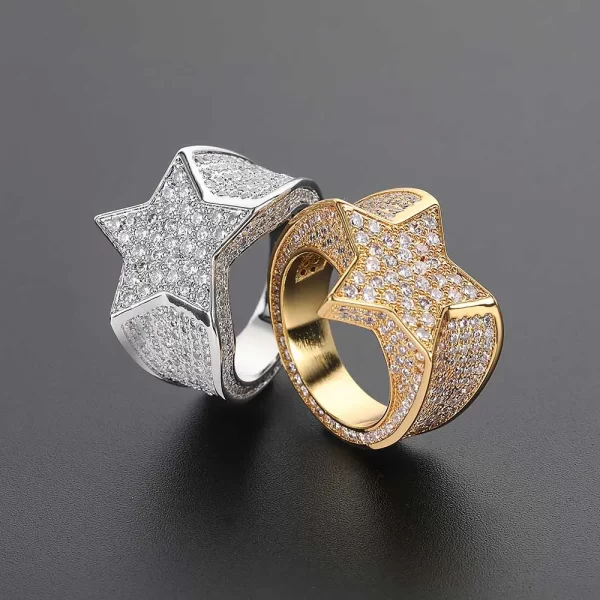 Shine like a star with the Iced Star Diamond Ring. This dazzling Yellow Gold Plated ring is adorned with VVS Simulated Diamonds set in a striking star shape, adding cosmic energy to your jewelry game. Its standout design makes it ideal for Hip Hop lovers looking to elevate their style with a celestial twist.