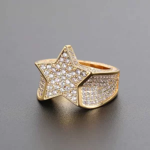 Shine like a star with the Iced Star Diamond Ring. This dazzling Yellow Gold Plated ring is adorned with VVS Simulated Diamonds set in a striking star shape, adding cosmic energy to your jewelry game. Its standout design makes it ideal for Hip Hop lovers looking to elevate their style with a celestial twist.