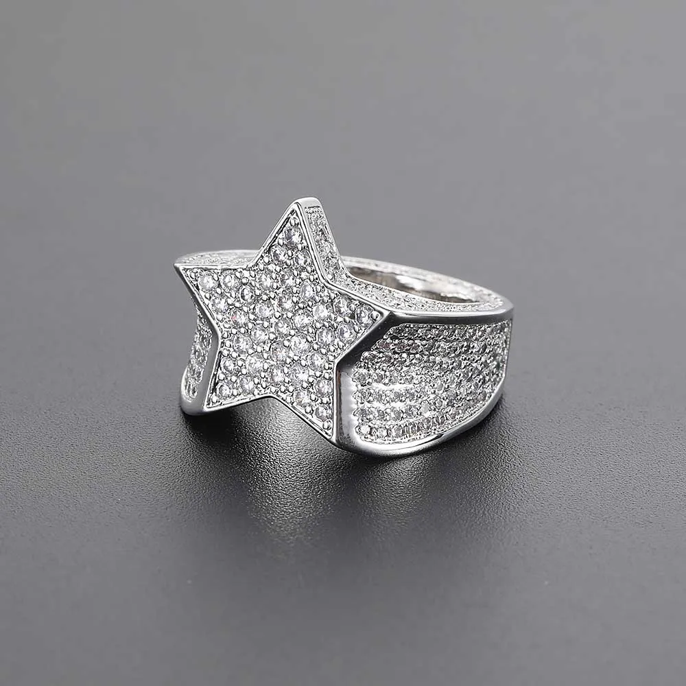 The Iced Star Diamond Ring in White Gold offers a celestial touch with its bold star-shaped design. Adorned with VVS Simulated Diamonds, this White Gold ring adds a cosmic twist to any outfit. It¡¯s the perfect accessory for Hip Hop fans who want to shine with starry brilliance.