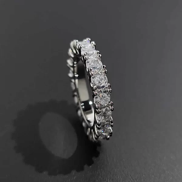 The 1 Layer Iced Prong Ring in White Gold combines elegance and luxury. Featuring VVS Simulated Diamonds in a prong setting, this White Gold band sparkles with brilliance, making it the perfect choice for both everyday wear and special occasions. Its sleek design adds a refined touch to any Hip Hop jewelry collection.