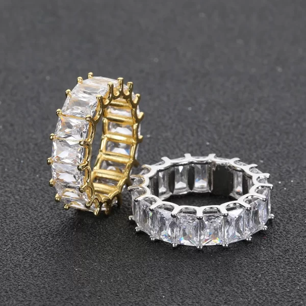 The 1 Layer Iced Square Ring in Yellow Gold offers a sleek, minimalist design with a square pattern adorned with VVS Simulated Diamonds. The luxurious Yellow Gold finish adds a touch of refinement, making this ring perfect for those who appreciate understated elegance in their Hip Hop jewelry collection. The square design brings balance and structure, making it versatile for any occasion.