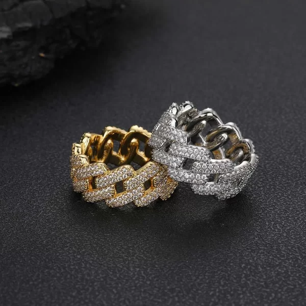 The Iced Prong Cuban Ring in Yellow Gold - 11mm is designed for those who love bold, oversized jewelry. Featuring prong-set VVS Simulated Diamonds and a luxurious Yellow Gold finish, this 11mm ring adds a powerful touch of luxury to any outfit. Its wide design makes it a perfect statement piece for Hip Hop fans who appreciate high-end style and want to stand out in any setting.