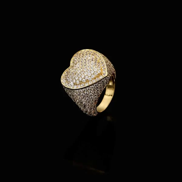 Show your love with the Iced Bling Heart Ring in Yellow Gold. This Gold Plated ring features a heart-shaped design with VVS Simulated Diamonds, perfect for adding a touch of romance and luxury to your Hip Hop look. Ideal for gifting or personal wear, it¡¯s a stunning piece that expresses both style and affection.