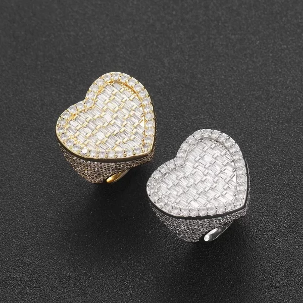 The Iced Heart Diamond Ring in Yellow Gold is the ultimate symbol of love and style. Crafted with VVS Simulated Diamonds and a luxurious Yellow Gold band, this ring features a heart design that adds a romantic edge to any look. Whether you're celebrating love or just looking to add some sparkle to your outfit, this piece is perfect for any occasion.