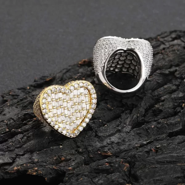 The Iced Heart Diamond Ring in White Gold delivers elegance and brilliance with its heart-shaped design. Featuring VVS Simulated Diamonds set in a White Gold band, this ring adds a touch of romance and sophistication, making it the perfect accessory for both casual and formal occasions in Hip Hop style.