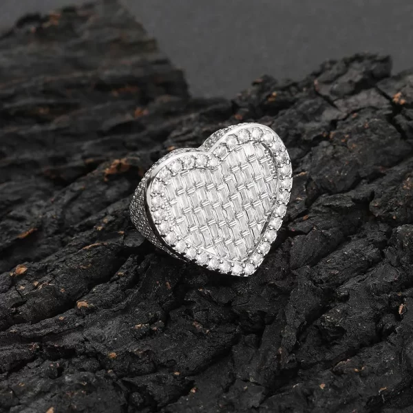 The Iced Heart Diamond Ring in White Gold delivers elegance and brilliance with its heart-shaped design. Featuring VVS Simulated Diamonds set in a White Gold band, this ring adds a touch of romance and sophistication, making it the perfect accessory for both casual and formal occasions in Hip Hop style.