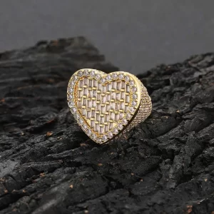 The Iced Heart Diamond Ring in Yellow Gold is the ultimate symbol of love and style. Crafted with VVS Simulated Diamonds and a luxurious Yellow Gold band, this ring features a heart design that adds a romantic edge to any look. Whether you're celebrating love or just looking to add some sparkle to your outfit, this piece is perfect for any occasion.