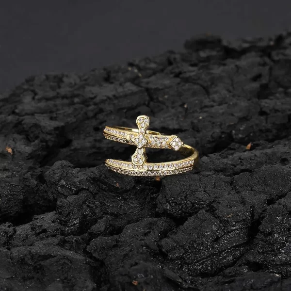 The Iced Cross Open Ring in Yellow Gold is a bold statement piece with a modern take on the classic cross design. Featuring VVS Simulated Diamonds set in an open cross shape, this Yellow Gold ring offers versatility and style. Whether layered with other rings or worn solo, it's a perfect accessory for any Hip Hop fan who loves making a statement with their jewelry.