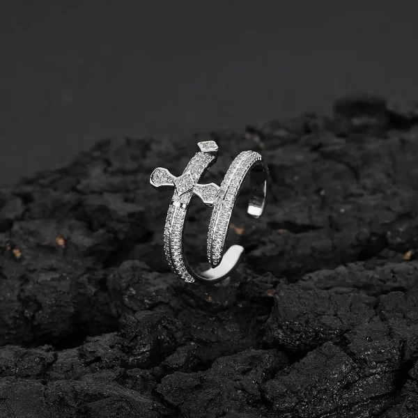 The Iced Cross Open Ring in White Gold features a sleek, modern twist on the classic cross symbol. With VVS Simulated Diamonds set in an open cross shape, this White Gold ring delivers both elegance and impact. Whether you're layering it or wearing it solo, this ring adds a unique touch to any Hip Hop-inspired outfit.