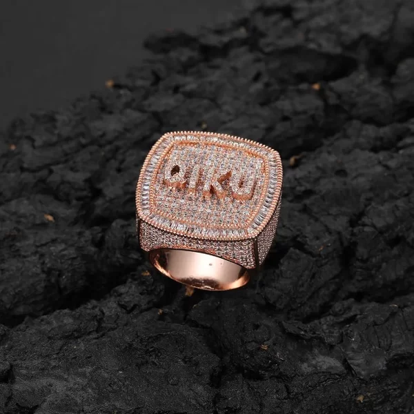 The Custom Letter 3D Iced Ring in Rose Gold is a bold, personalized accessory designed to stand out. Featuring custom letters set with VVS Simulated Diamonds, this Rose Gold Plated ring adds both luxury and individuality to your Hip Hop look. It¡¯s perfect for those who love bold, customized fashion statements.