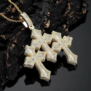 The Iced Baguette Cross Pendant offers a dazzling twist on the classic cross design. Crafted with gold plating and encrusted with shimmering diamonds, this pendant adds an element of luxury to any outfit. Hypoallergenic, waterproof, and scratch-resistant, it's designed for everyday wear, from casual to formal occasions. A perfect gift or personal statement piece, this pendant embodies elegance and strength, combining the best of classic and Hip Hop style.